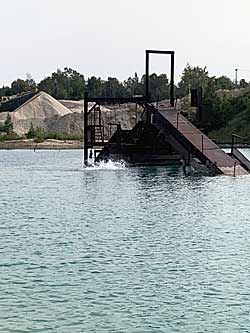 Some quarries have equipment left behind when the water started coming in.