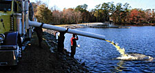 After several hours of acclimation and 'tempering,' bass were released into Richmond Mill Lake