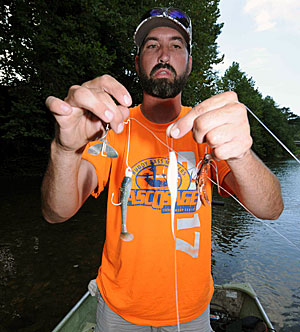 Guide Tommy Bench’s three favorite lures for river smallmouth in late summer and early fall are a buzz bait, Fluke, and jig-and-craw combo.