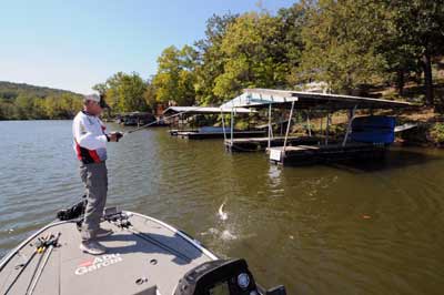 Boat docks, brush piles and logs are Harold Stark’s favorite targets for pitching and skipping stick worms to fall bass hiding in cover. 