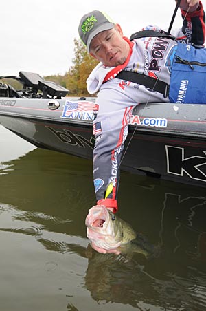 Scanning the shallows with his electronics helps Keith Combs find isolated submerged cover in murky water.