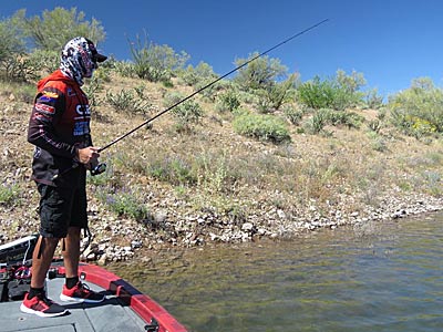 Lawrence uses the shoreline to keep his boat in place at times.