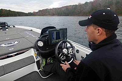 Aaron Martens scans his electronics to find bits and pieces of silted-in creek channels on aging reservoirs.