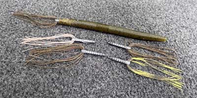 A matching or contrasting skirt at the rear of your soft plastic bait will give your rig a new look.