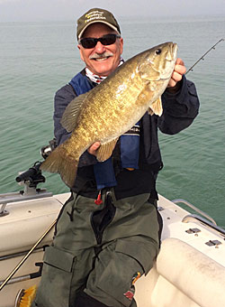 To catch giant smallmouths like the one Jim Balzer is holding requires that anglers familiarize themselves with the different styles of jig heads and learn how to fish them.