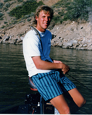 Impish Aaron Martens with  alligator lizard at Pyramid Lake.