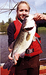 Kristen Coakley with a big largemouth bass captured during electrofishing.