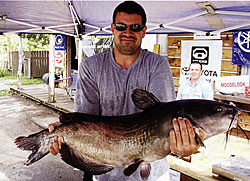 Brent Lehman with giant catfish caught from Lake Champlain.