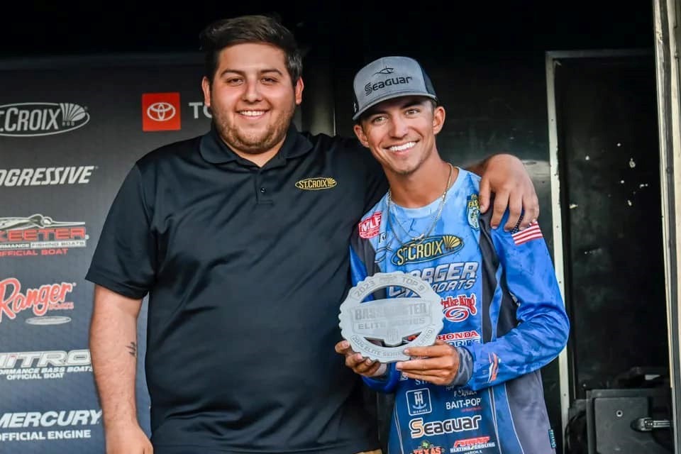 Trey and St. Croix Pro Staff and Show Coordinator, Cristian Simpkins, celebrate the 2024 Bassmaster Elite Series Qualifier award McKinney earned as a result of his 2023 Bassmaster Opens Series performance.