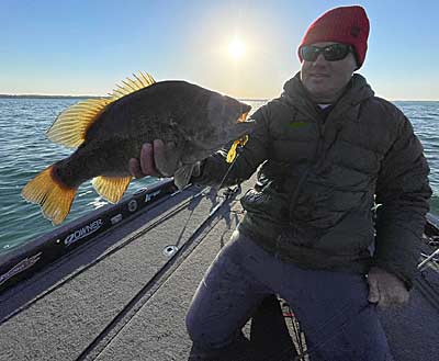 A big Michigan smallmouth bass caught by Stracner with a swing head while fishing a new lake for the first time.