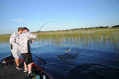 Erik Tilson gets ready to net Kent Hickman’s bass during ICAST Cup action at Lake Toho.