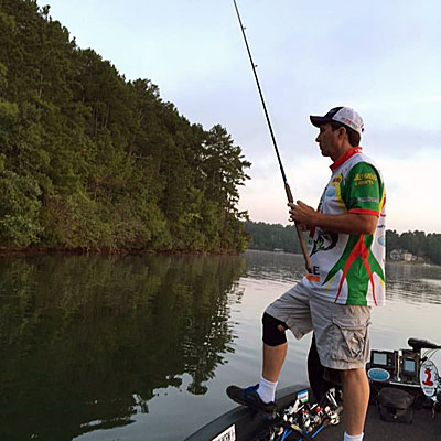 Eddie Johns (standing on deck fishing)