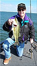 Tom Lester II, with a Lake Richland - Chambers fall bass caught on a Strike King Wild Thang, Quarrow Dream Catcher signature series 6'8" 5 Power Worm Rod, 4/0 Gamakatsu EWG hook and 15# P-Line CXX under a boat dock.