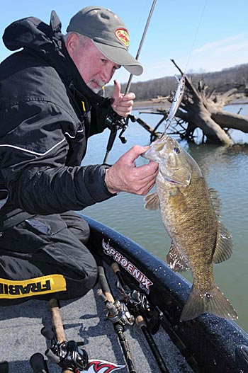 Terry Blankenship concentrates on deeper holes of reservoir tributaries to catch bass in the early spring.