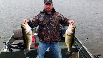 SOLitude s Paul Dorsett shows off two bass larger than 11 pounds.