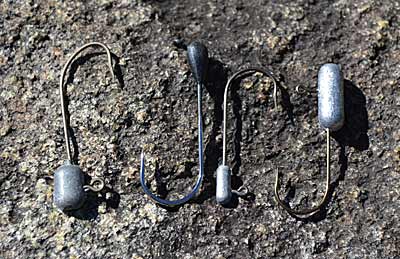 A lead head’s shape plays a big role in how a tube jig acts. Round and cylindrical ones roll and hunt when dragged across the bottom. Flat ones make tubes dip and dive when jigged. Photo by Pete M. Anderson