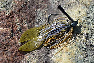 It’s hard to beat bass jigs, whether you’re fishing for numbers or size, anytime of the year. They really shine in summer on lakes and rivers where aquatic vegetation grows. And they’re even better with a few tweaks. Photo by Pete M. Anderson