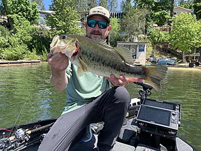 The author with a largemouth that bit a wacky-rigged bait on a drop-shot near a shallow dock.