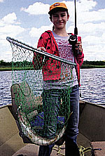 Retired SDSU Wildlife and Fisheries Sciences department head Chuck Scalet's grand-daughter Olivia shows off a very nice walleye grown in a northern pond.