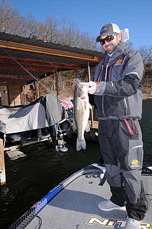 Casey Scanlon catches wintertime bass from boat docks sitting over or near deep water structure. 