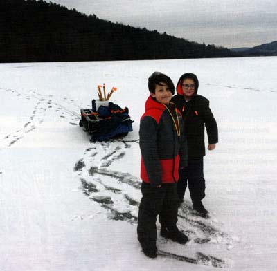 Ice fishing is great fun in the north. The sled carries supplies, including safety supplies such as ice picks.