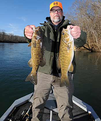 Smallmouth bass are easier for Bill Smith to locate in the winter when the fish congregate in deep holes of the river. 