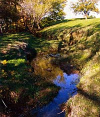 The creek flowing from Bedford Boy's Ranch pond dwindles down to a trickle at spots.