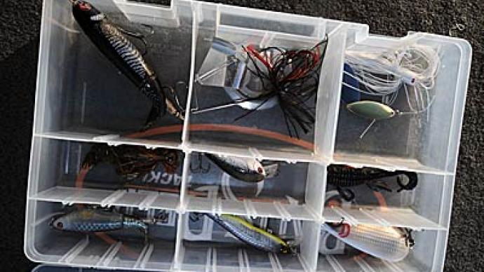 Beginning anglers can organize their lures and other gear by carrying a tackle management system with plastic utility boxes stored in a soft-side bag.