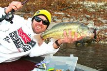 Alan McGuckin, a fishing industry marketer for the past 18 years, is an avid angler on Grand Lake. Note the small patch of snow on the shoreline behind him.