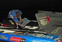 Rojas readies a tackle tray full of soft plastic lures in the pre-dawn of Sunday morning.